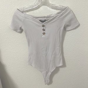 White off the shoulder ribbed three button bodysuit
